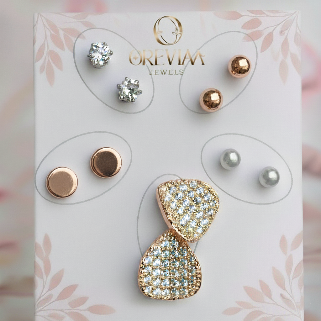 Set of earrings on a display card with 'Orevim Jewels' branding.