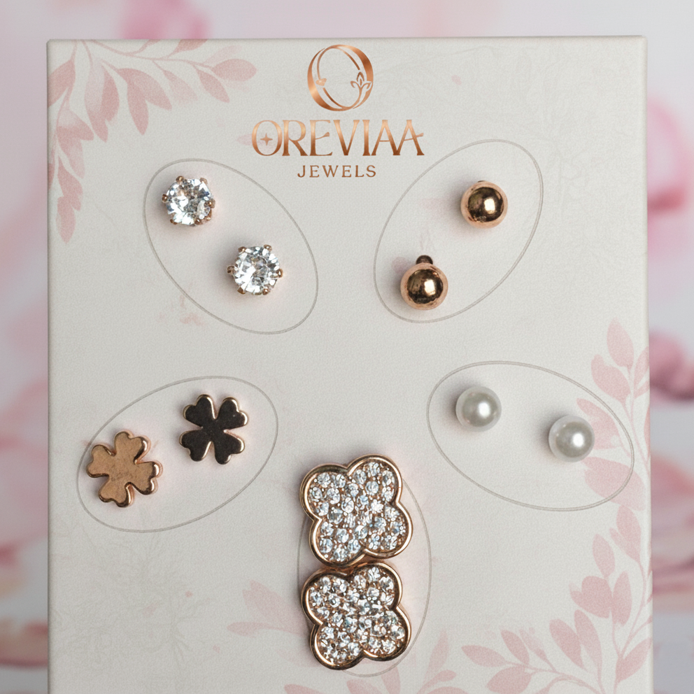 Set of earrings on a display card with Orevia Jewels branding against a floral background.
